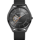 BERING automatic wristwatch with open dial showing mechanical movement, dark gray case, mesh metal band, front view.