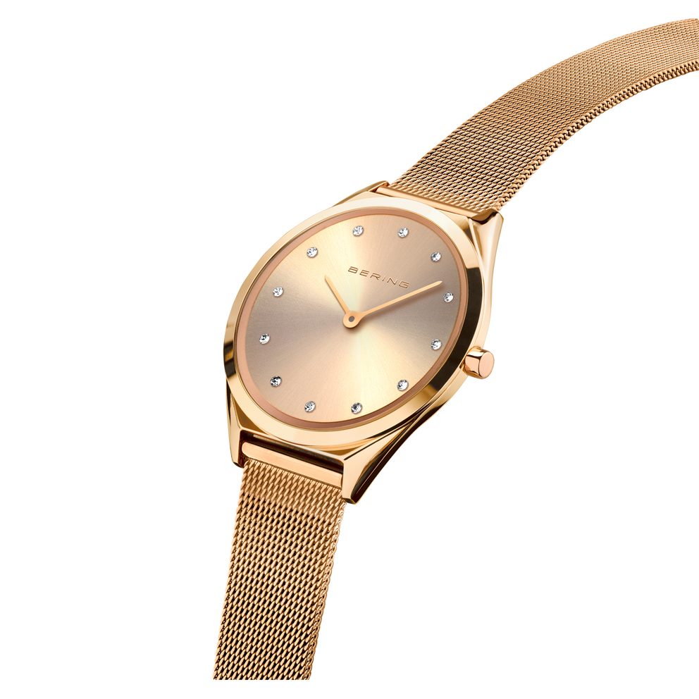 Rose gold round-dial watch with mesh bracelet, shown at three-quarter angle to display case and strap texture