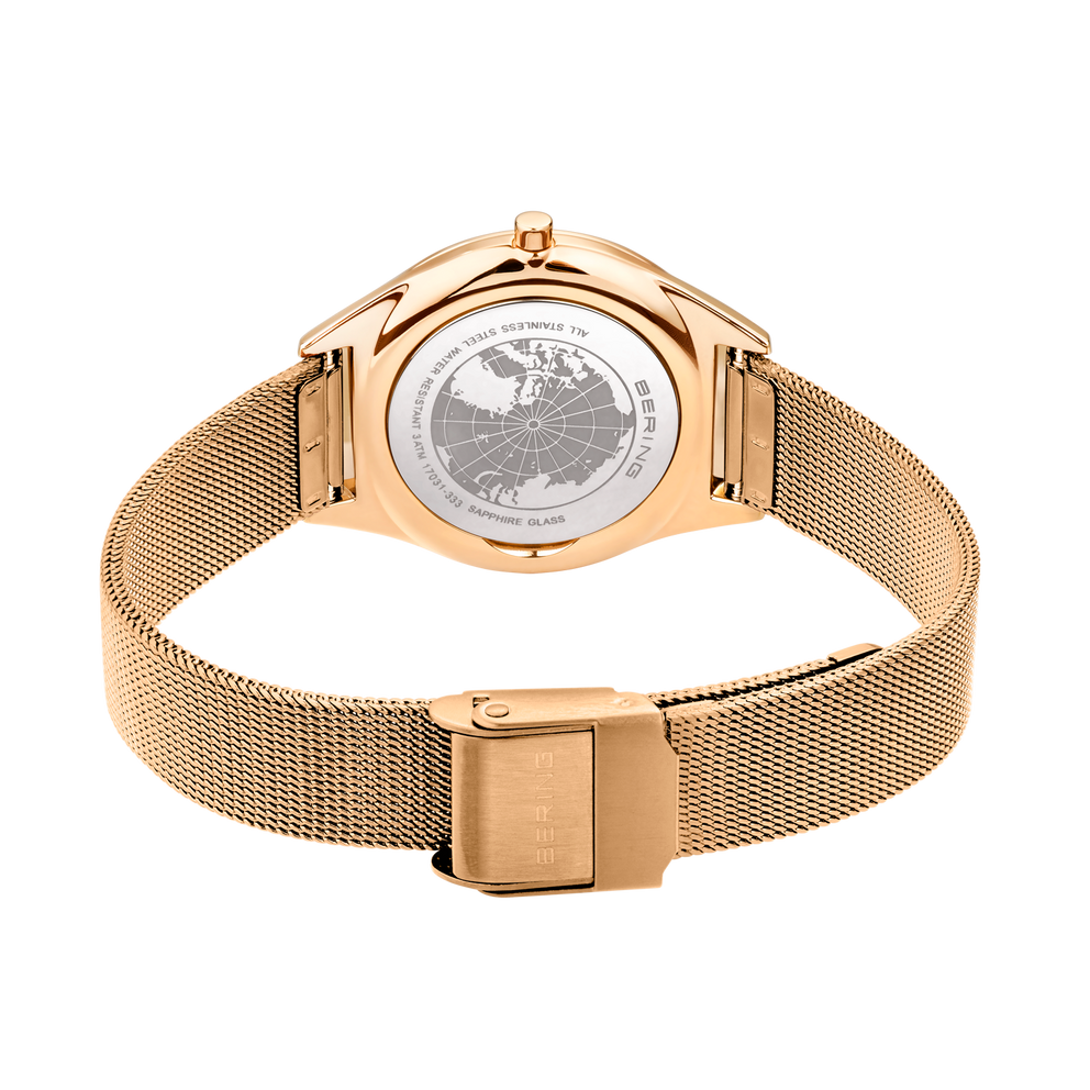 BERING watch back showing world map dial, rose gold case and magnetic mesh bracelet