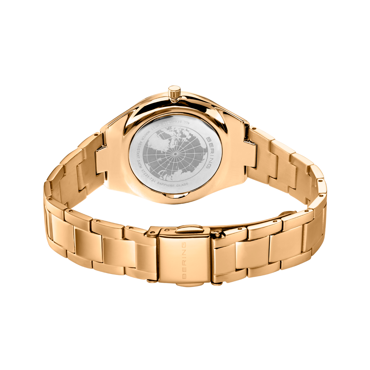 Ur set bagfra med roséguldmetalarmband og gravert baglåg.