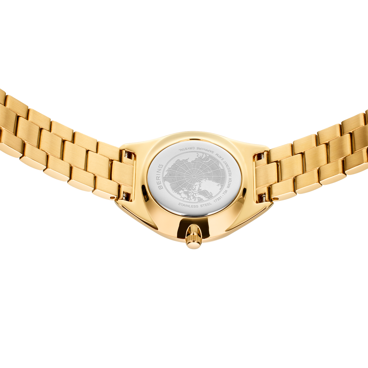 Bracciale dorato e fondello di orologio con maglie geometriche.
