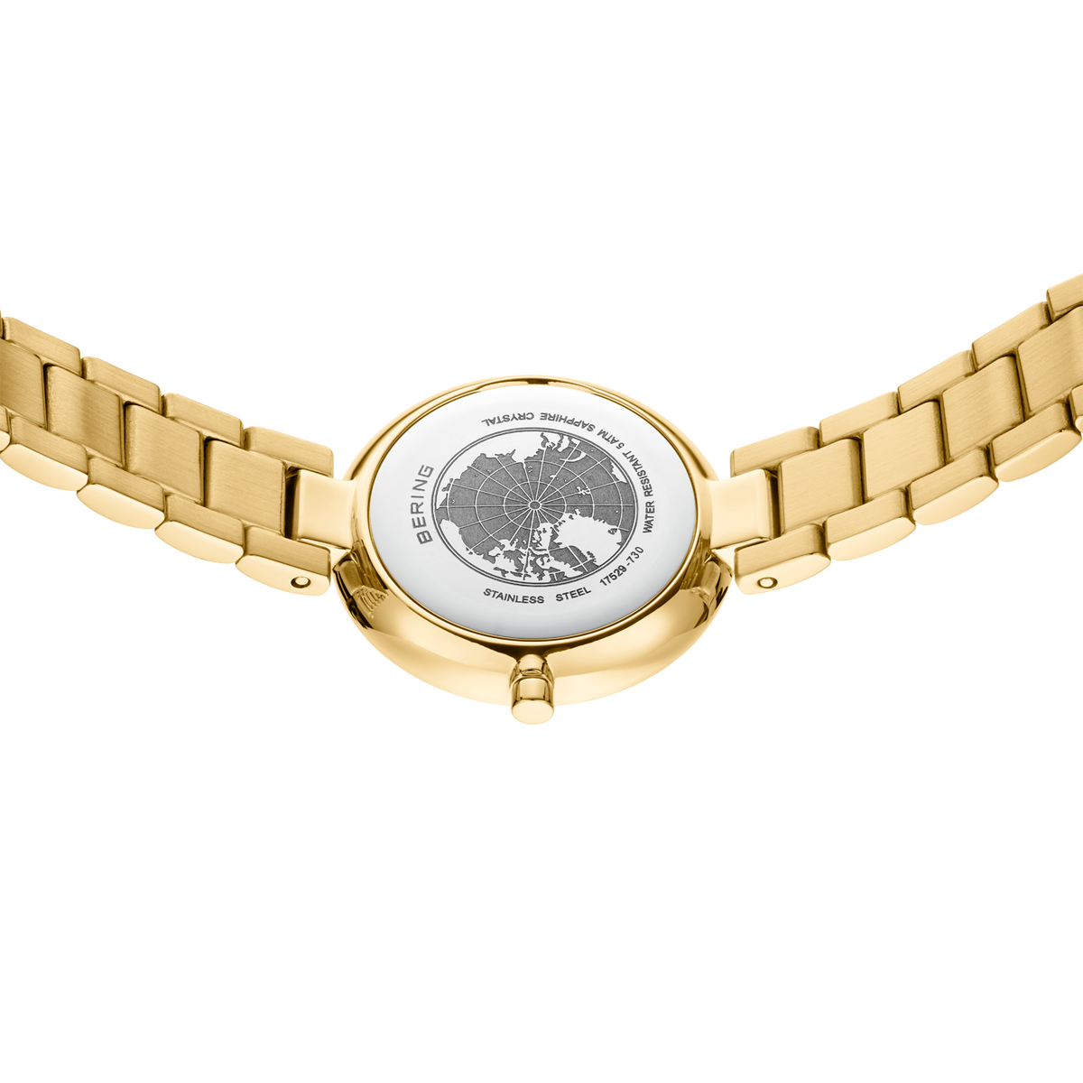 Parte trasera del reloj dorado con águila grabada