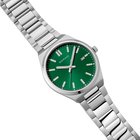 Stainless steel wristwatch with green dial and white hour markers, photographed at angle to show link bracelet.