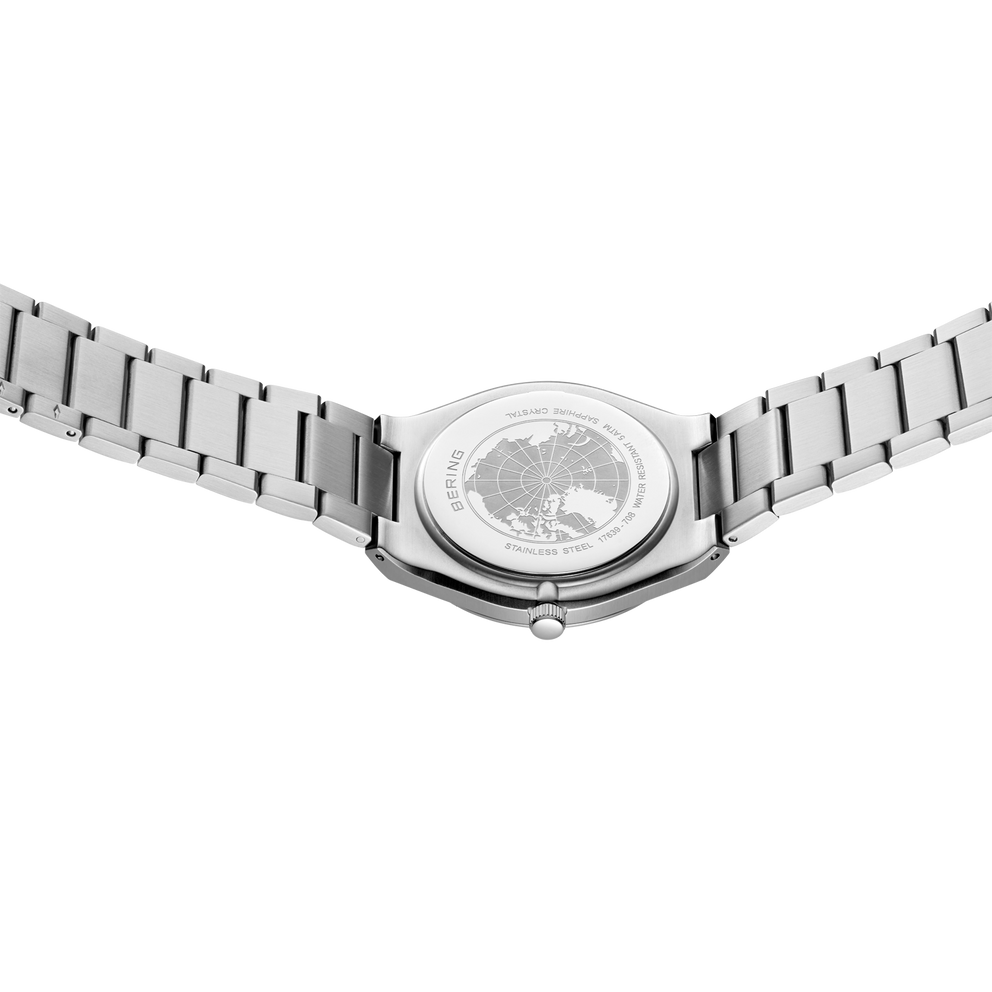 Watch 17639-708 shown from above, revealing transparent case back and metallic link bracelet