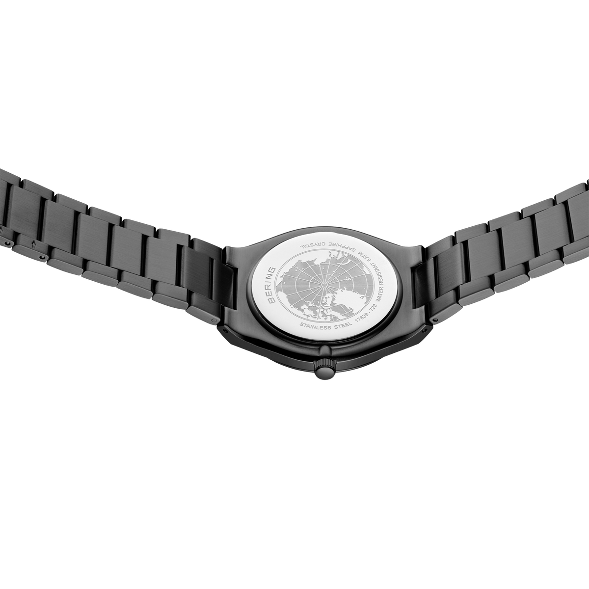 Reloj de pulsera en metal negro visto desde atrás con fondo transparente y mecanismo visible
