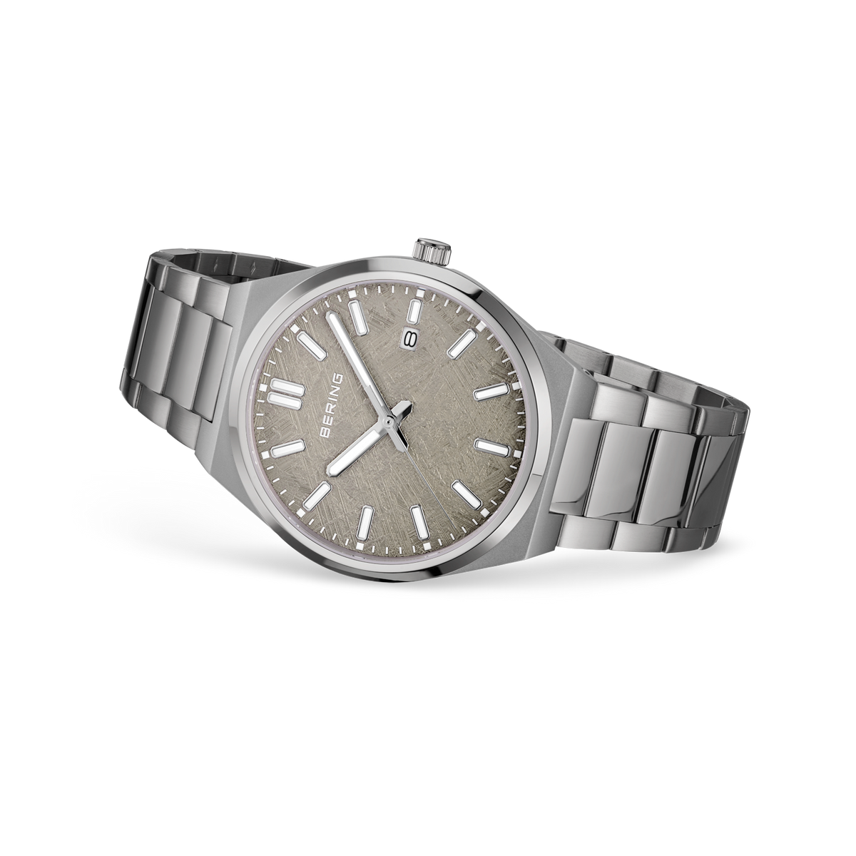 Round steel watch with taupe dial, white hands, date window, and brushed steel bracelet with polished center links, shown at angle.
