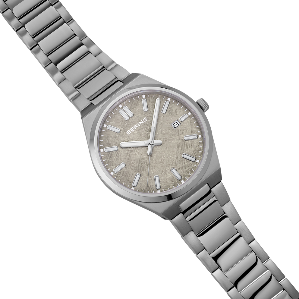 BERING watch with beige dial, applied indices, and steel link bracelet, angled view.