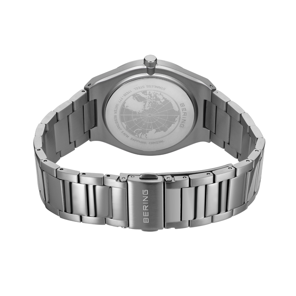 BERING watch with metal bracelet, photographed from the rear showing engraved case back and articulated links.