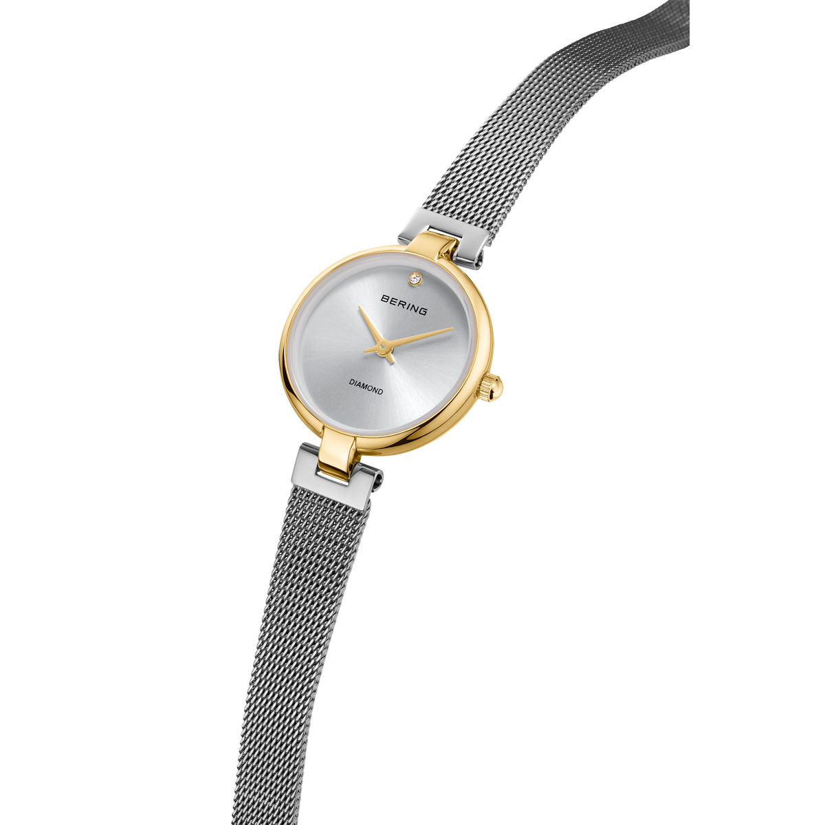 Round watch with gold case, silver dial, and dark mesh strap displayed diagonally.