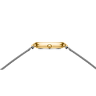 Rectangular gold-tone watch case with silver mesh bracelet, viewed from above