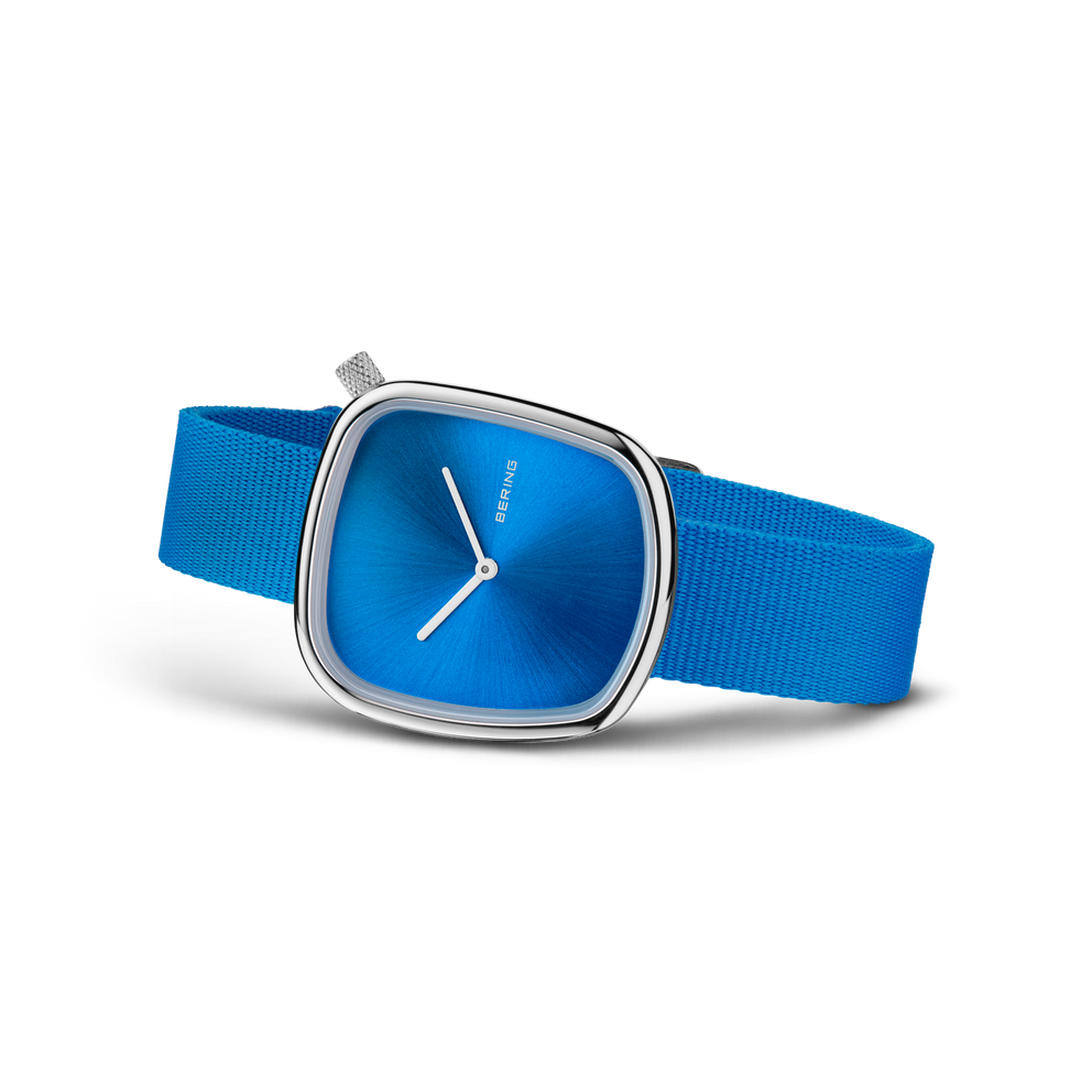 BERING wristwatch 18034-308 with blue square face, silver case, and blue textile strap shown at an angle
