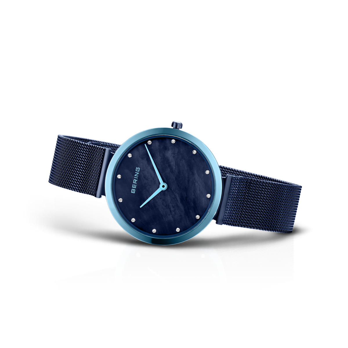 Blue-cased watch with dark dial and mesh band, angled detail view