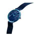BERING wristwatch with dark blue dial, teal case rim, and navy mesh strap, angled detail view.