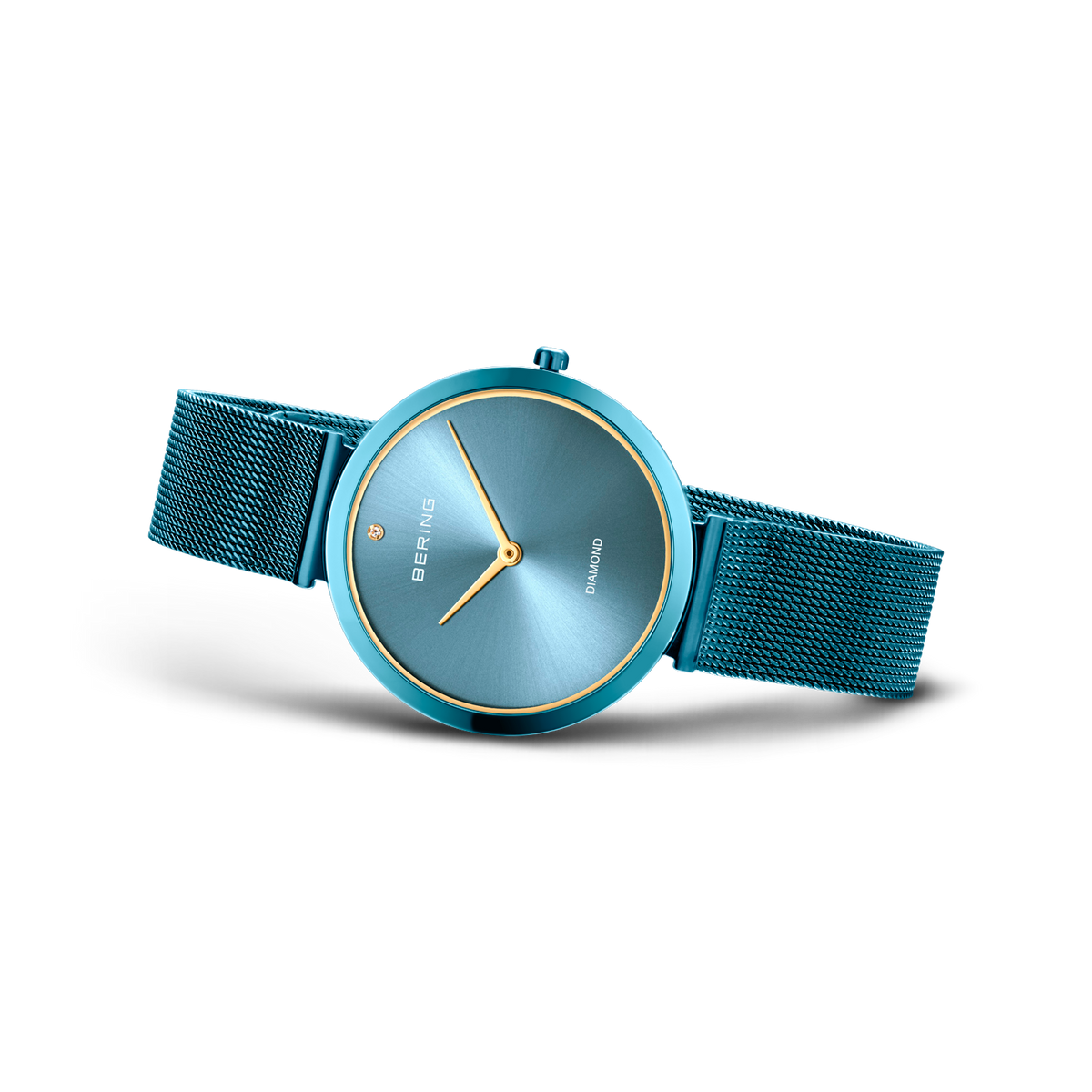 BERING Charity1 wristwatch with teal mesh band, round case, and gray-blue dial with gold hands, angled view.