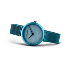 Turquoise watch with mesh band, textured dial and three hands from three-quarter angle