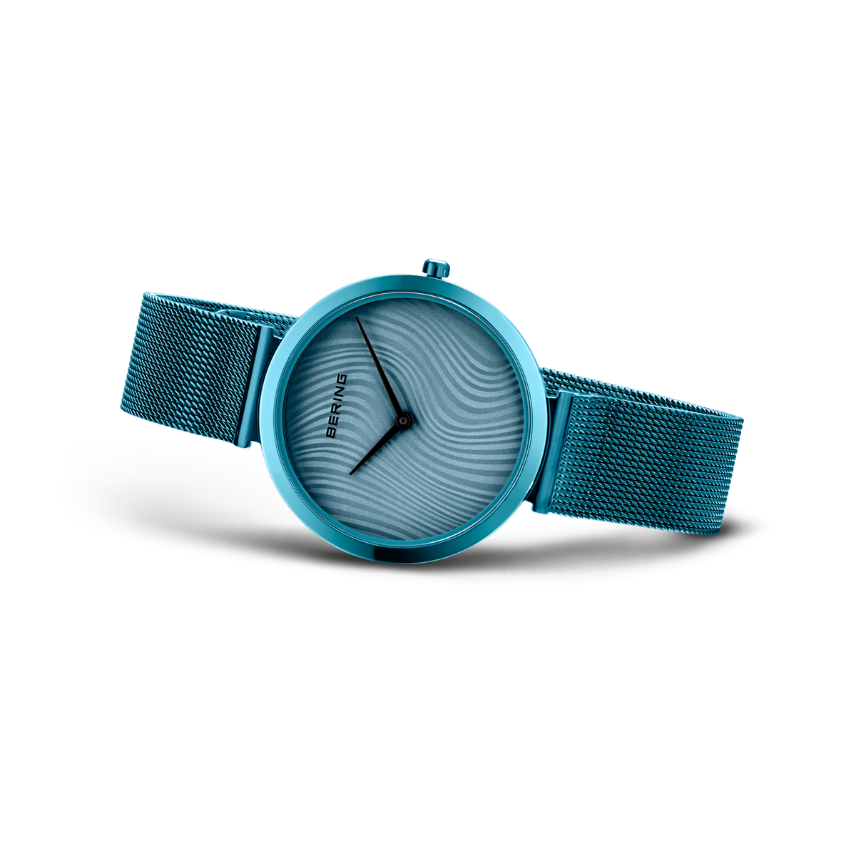 Turquoise watch with mesh band, textured dial and three hands from three-quarter angle