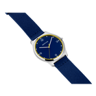 Round silver watch with dark blue dial, gold trim, and navy fabric strap.