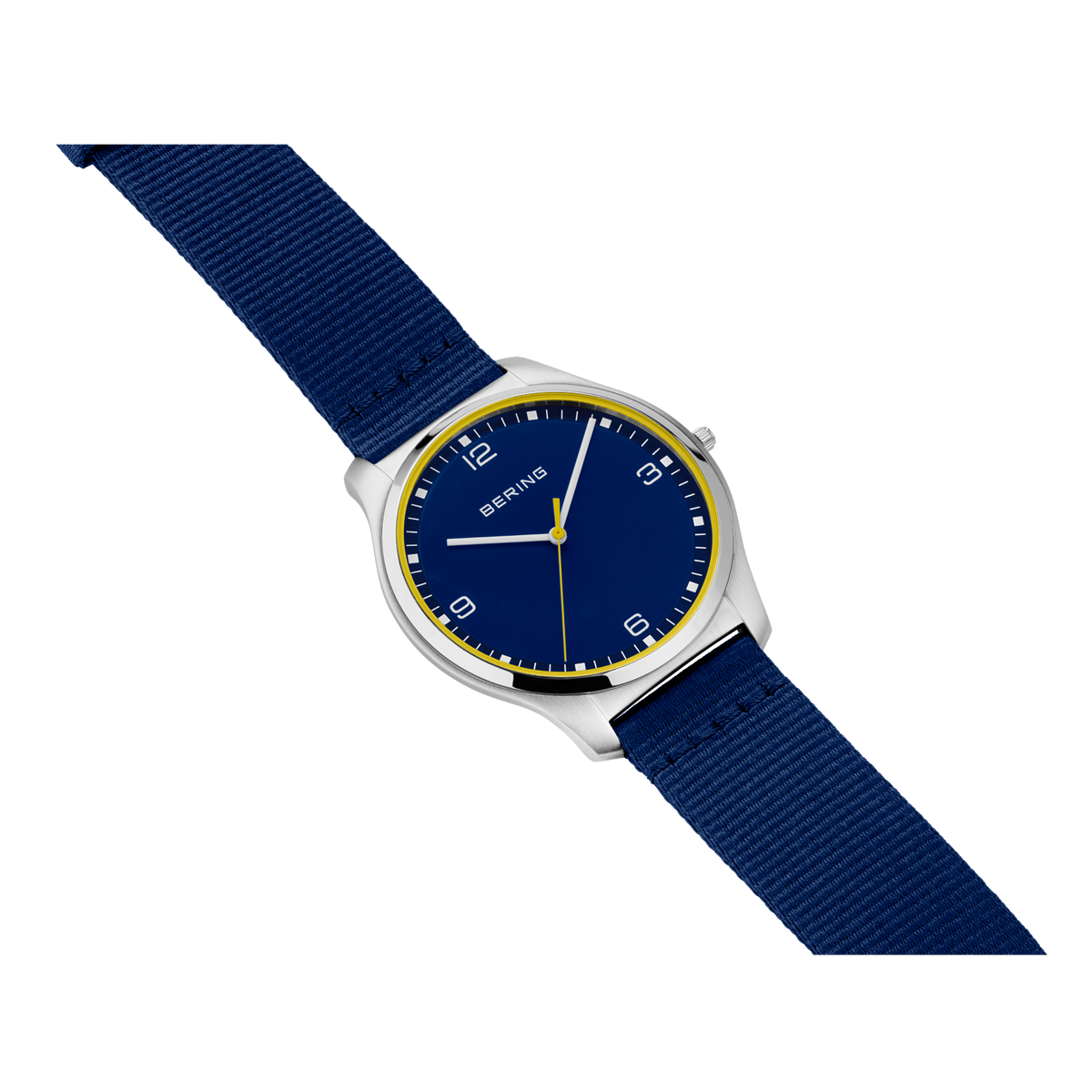 Round silver watch with dark blue dial, gold trim, and navy fabric strap.