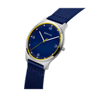 BERING watch angled view: dark blue dial, silver case, gold accents, navy fabric strap