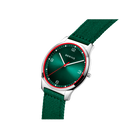 Watch with dark green dial and bezel, silver case, and green fabric strap, photographed at angle