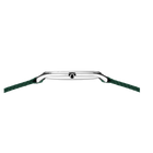 Silver-cased watch with round dial, viewed from the side with green fabric strap attached at the lugs.