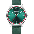 Silver watch with dark teal dial and red bezel, white hands, on green fabric strap