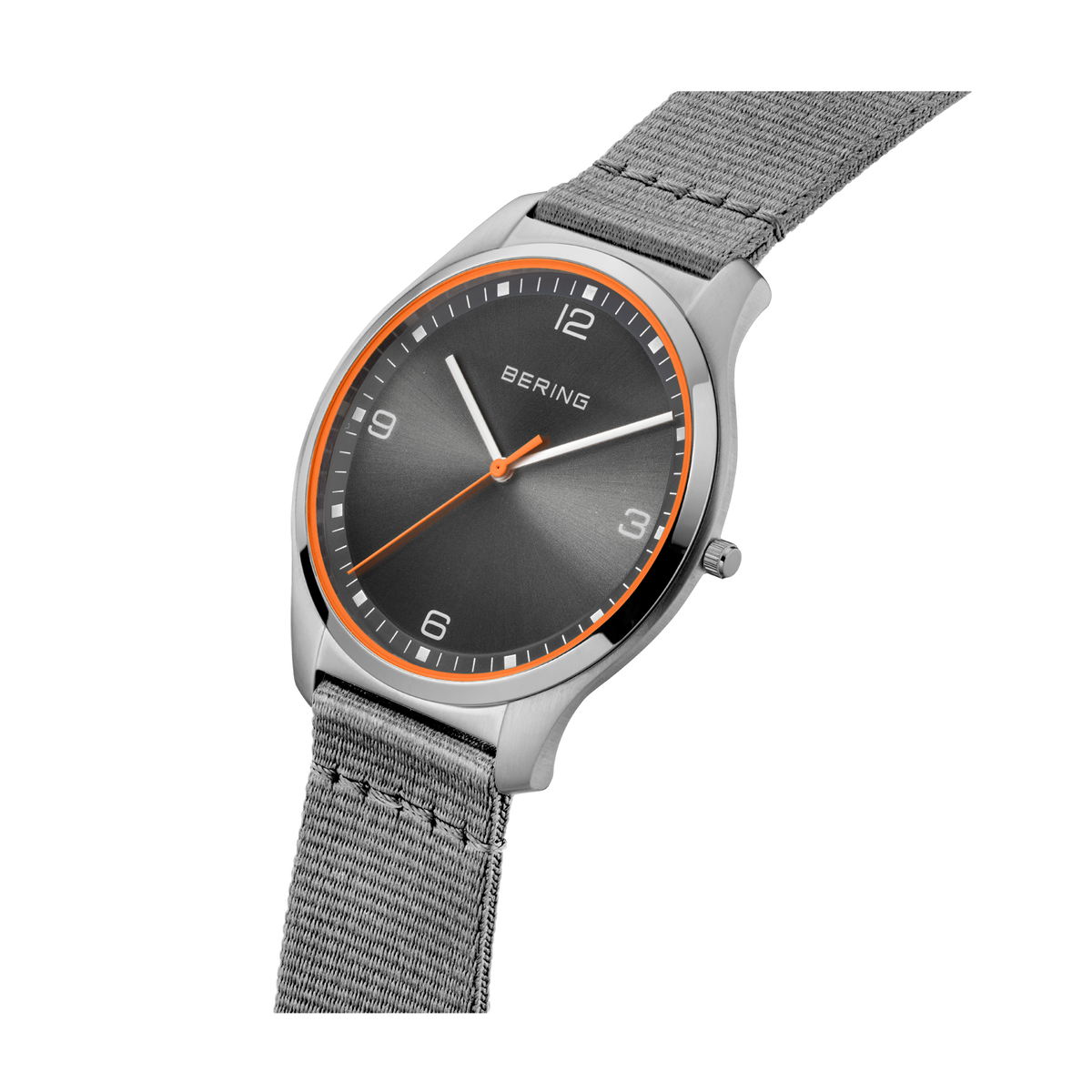 Wristwatch with dark dial, orange accent ring, and silver mesh band, displayed at angle showing face and strap.