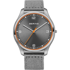 BERING watch with round stainless steel case, dark gray dial, orange bezel accent, white indices, and gray woven fabric band.