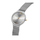 Silver round watch with dark dial, Roman numerals, and mesh metal strap, angled view.