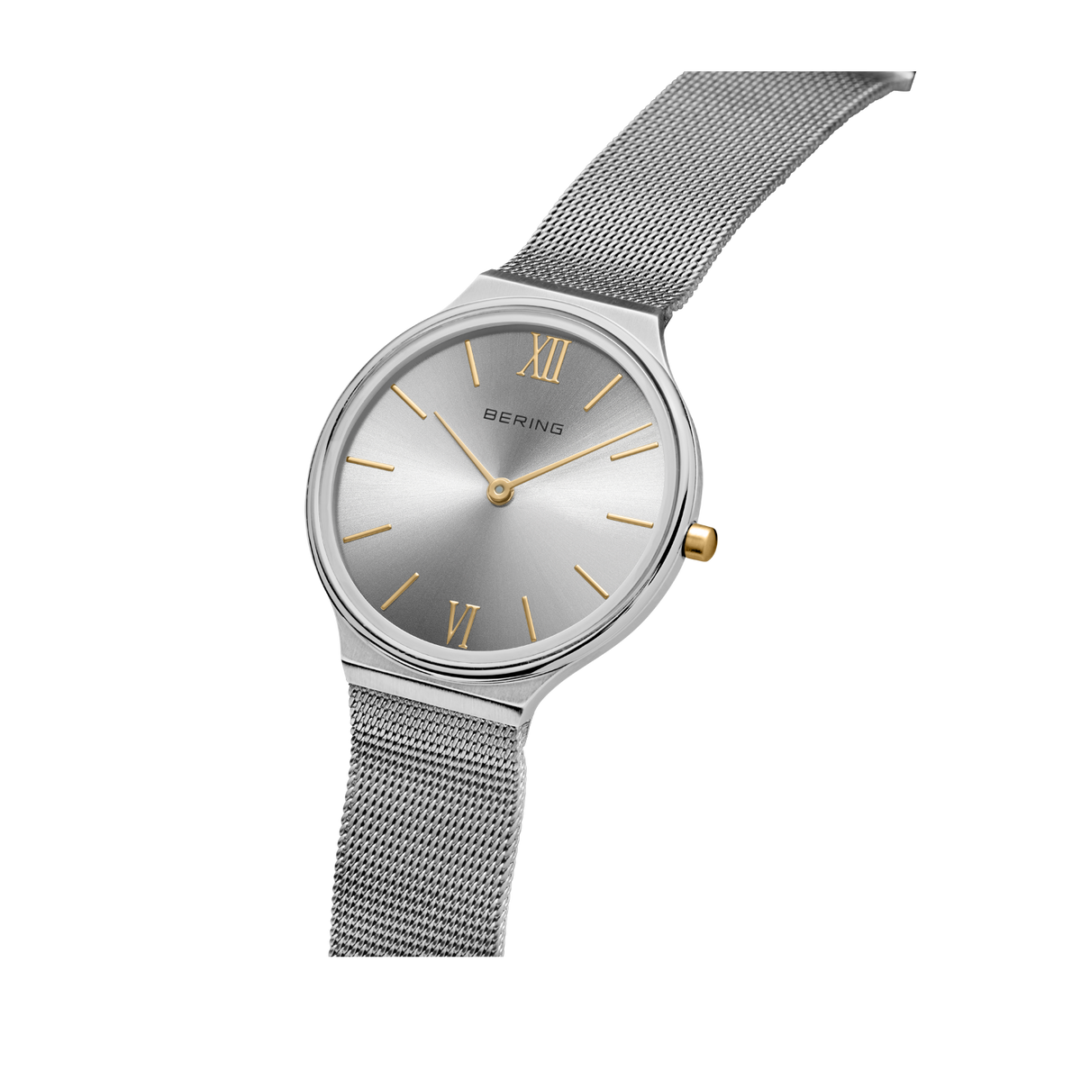 Silver round watch with dark dial, Roman numerals, and mesh metal strap, angled view.
