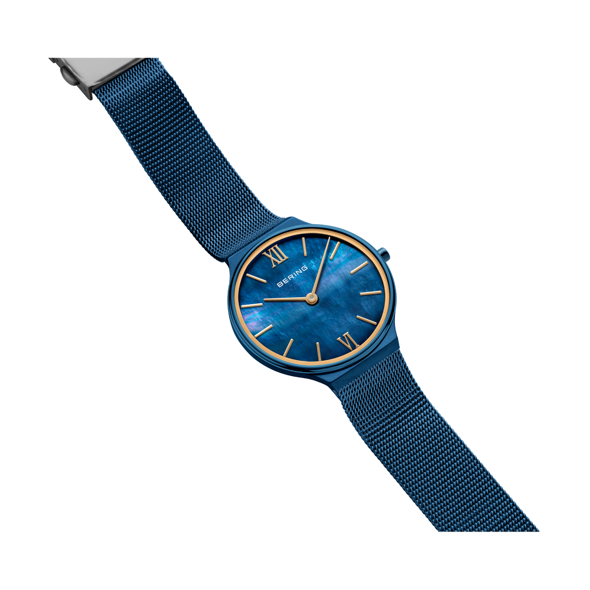 BERING watch with blue dial and gold indices, blue textile strap, angled view.