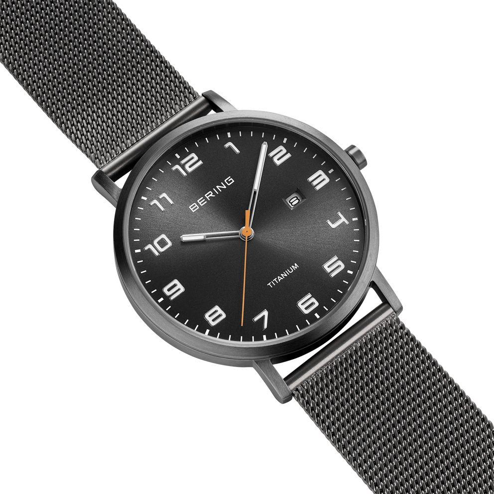 BERING titanium wristwatch with black dial, Arabic numerals, white hands, orange second hand, and gray mesh band