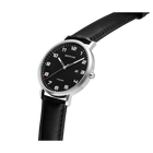 Round silver watch case with black dial, white hour markers and hands, black leather strap, shown at an angle.