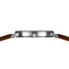 Silver-tone watch case shown in profile with brown leather band, emphasizing slim case design.