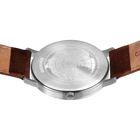 Watch caseback with brown leather strap and tan stitching detail