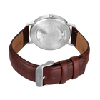 Watch shown from back with engraved silver caseback, brown leather strap, and metal buckle.