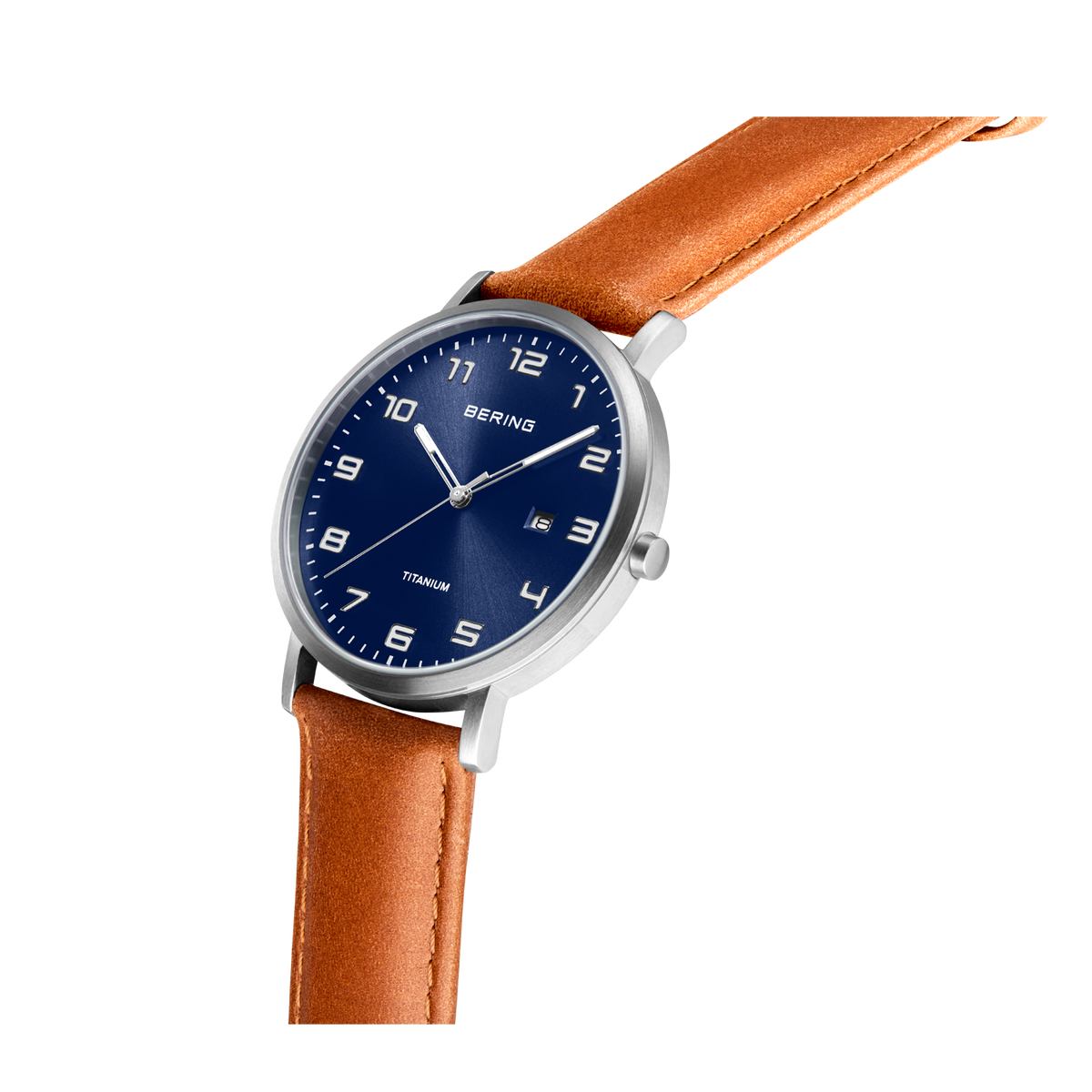 BERING wristwatch with silver case, navy dial with numerals, and tan leather strap, shown at angle.