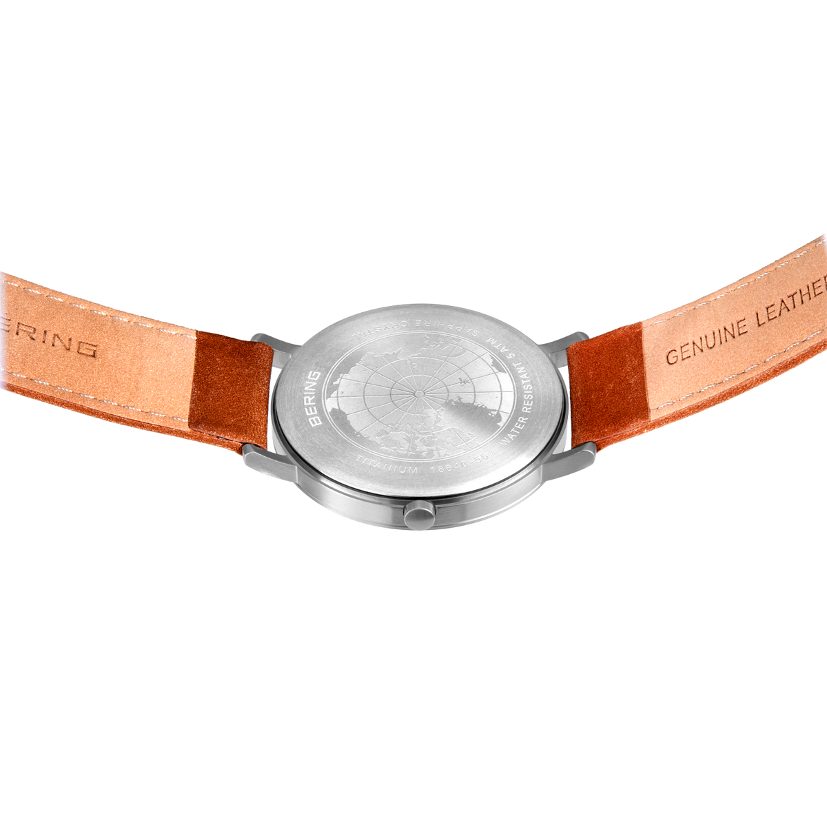 Back view of BERING wristwatch with cognac leather strap; "BERING" embossed left, "GENUINE LEATHER" embossed right.