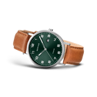 BERING watch with dark green dial, silver case, and brown leather strap, angled view