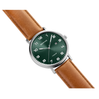 BERING wristwatch with green dial, silver case, and brown leather strap, shown at an angle.