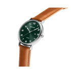Watch with dark green dial, silver case, and brown leather strap, shown at an angle
