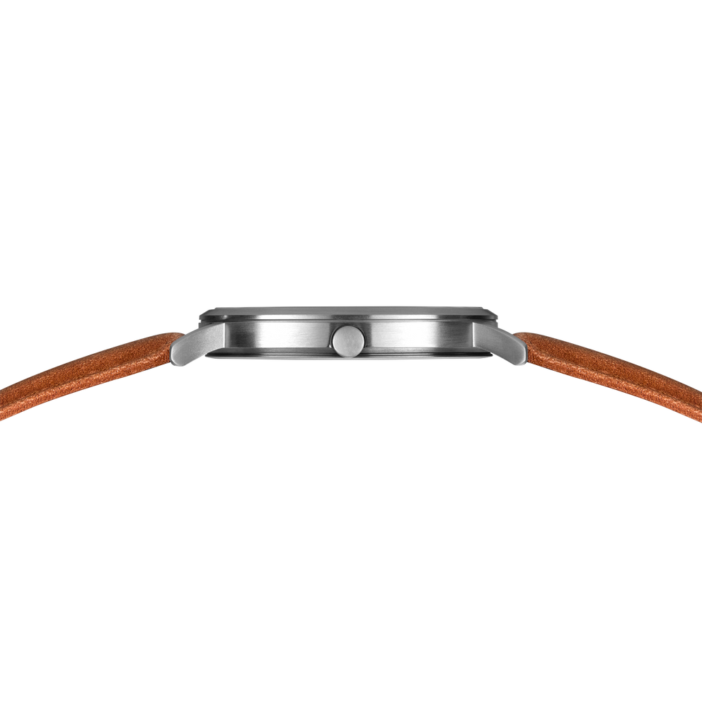 Side profile of watch case with brushed silver bezel and brown leather strap