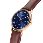 BERING watch with dark blue dial, Arabic numerals, rose gold case, and burgundy leather strap.