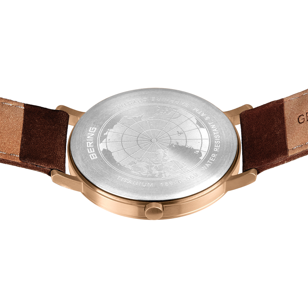 Watch back case in rose gold with brown leather straps, viewed from behind