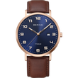 Montre BERING Titanium avec boîtier or rose, cadran bleu marine, chiffres arabes, guichet date et bracelet cuir marron.