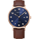 BERING Titanium watch with rose-gold case, navy dial, Arabic numerals, date window, and brown leather strap.