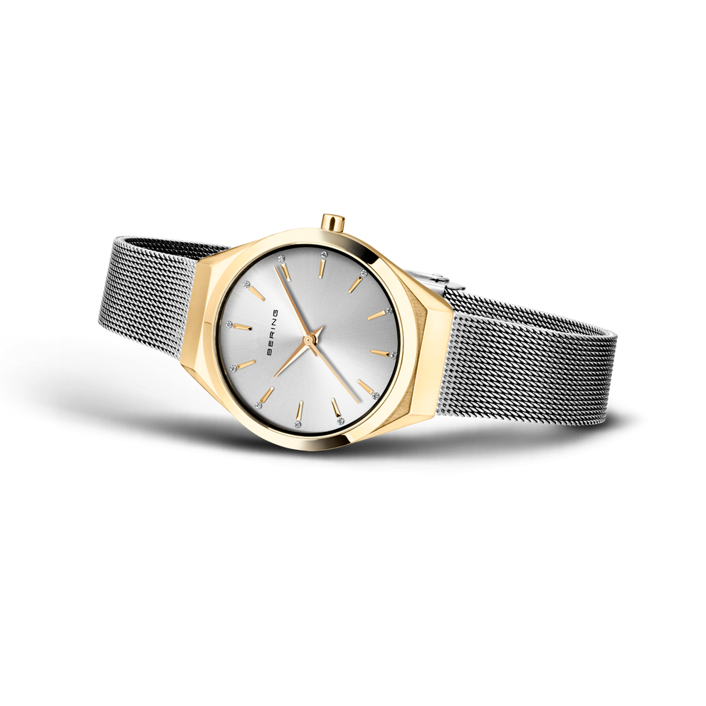 Zweifarbige Armbanduhr mit goldenem Gehäuse und Edelstahl-Mesh-Band in Schrägansicht mit Zifferblatt.
